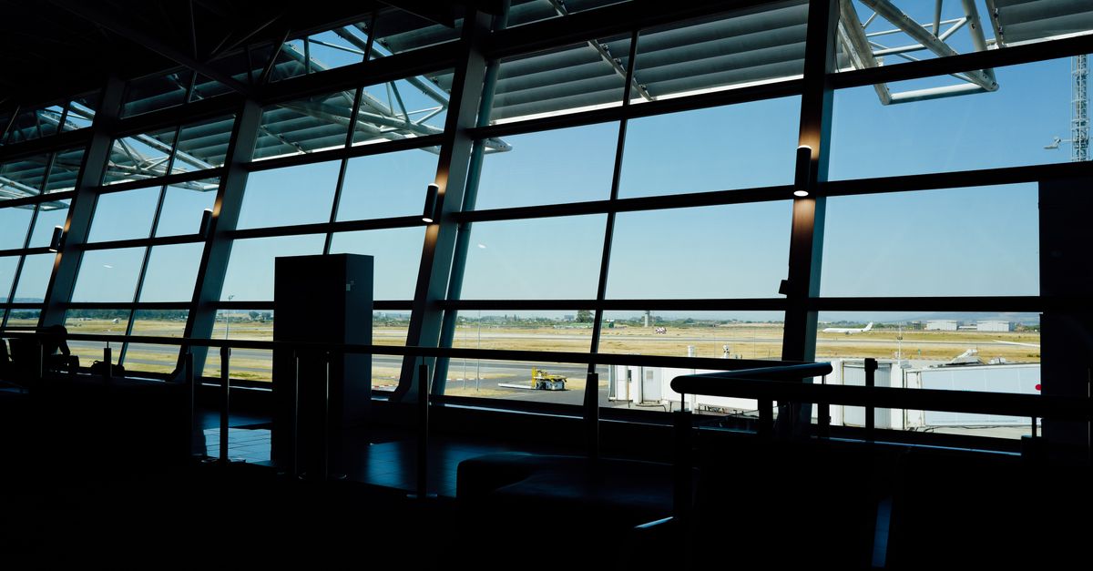 A window overlooking an airport runway.