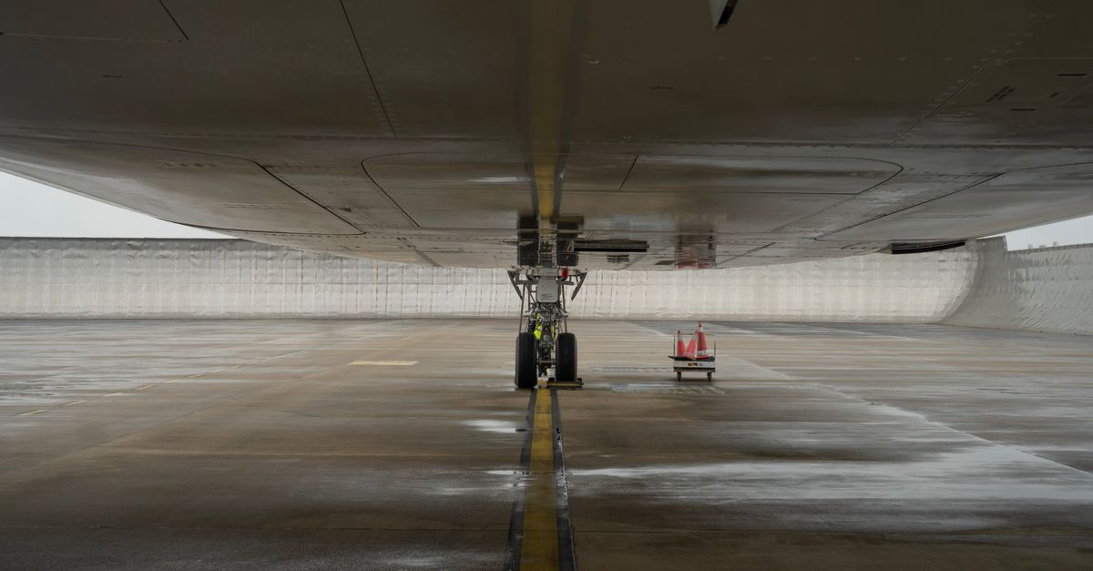 The main subject of the photograph is an airplane parked on the tarmac.