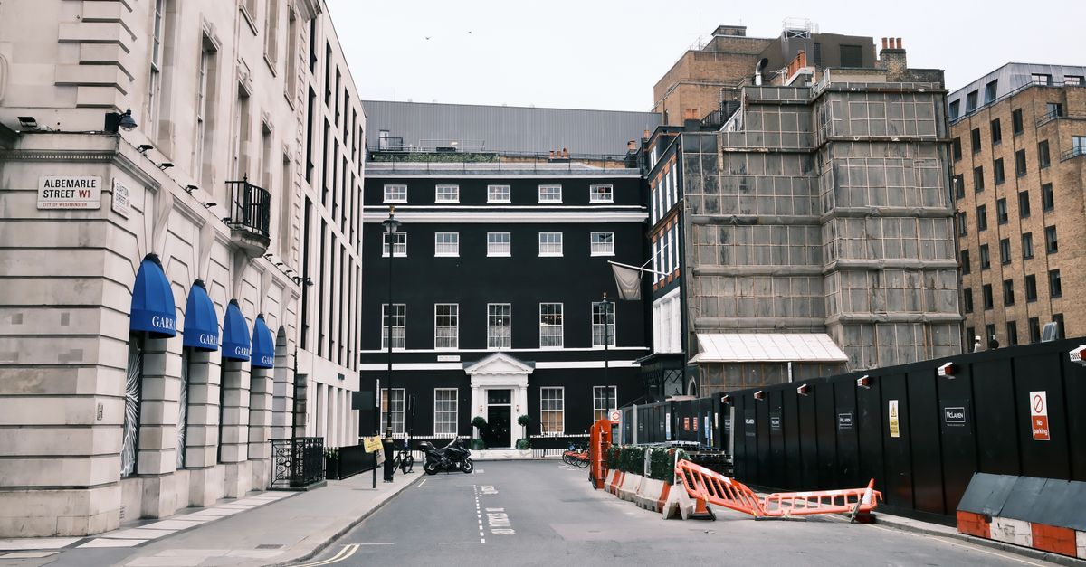 Street view of Albemarle Street, London with classic architecture.