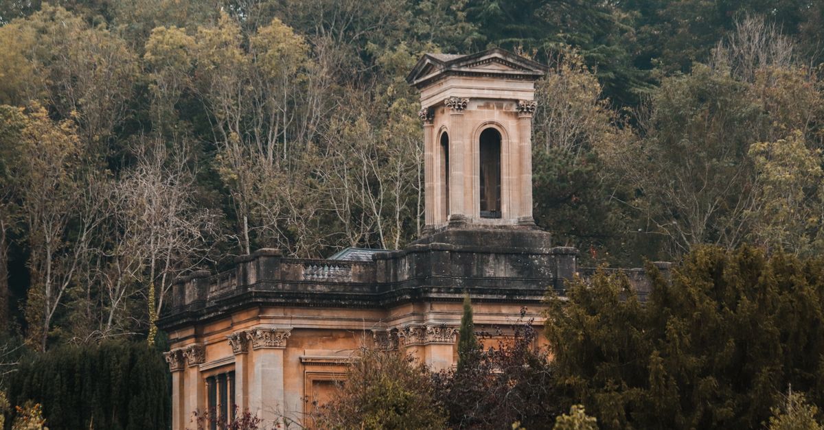 A vintage tower nestled in a dense forest landscape, Bristol, England.