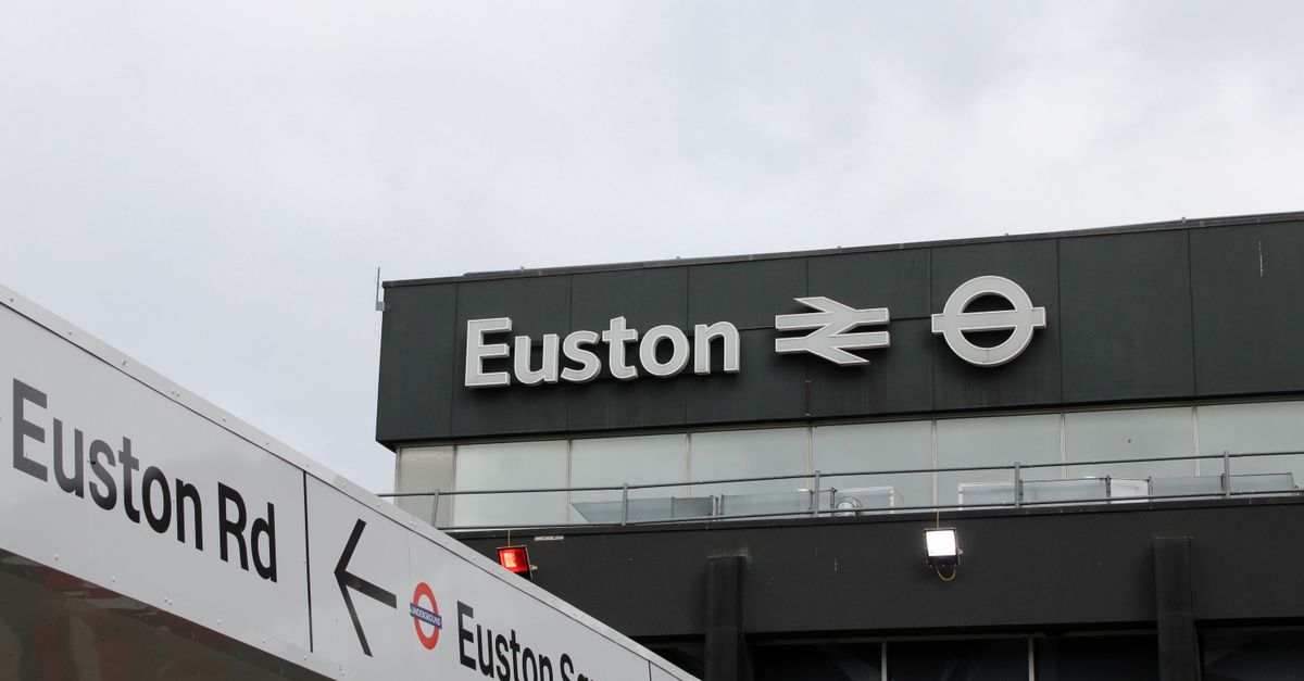 Euston Station signage featuring iconic symbols in London.