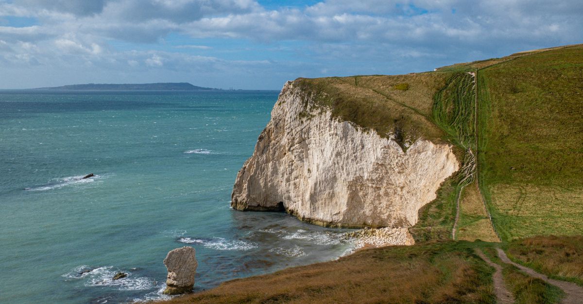 Explore the breathtaking cliffs along the Jurassic Coast in England, featuring dramatic views and natural beauty.